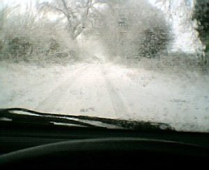 Dangerous, snowy road from driver's perspective